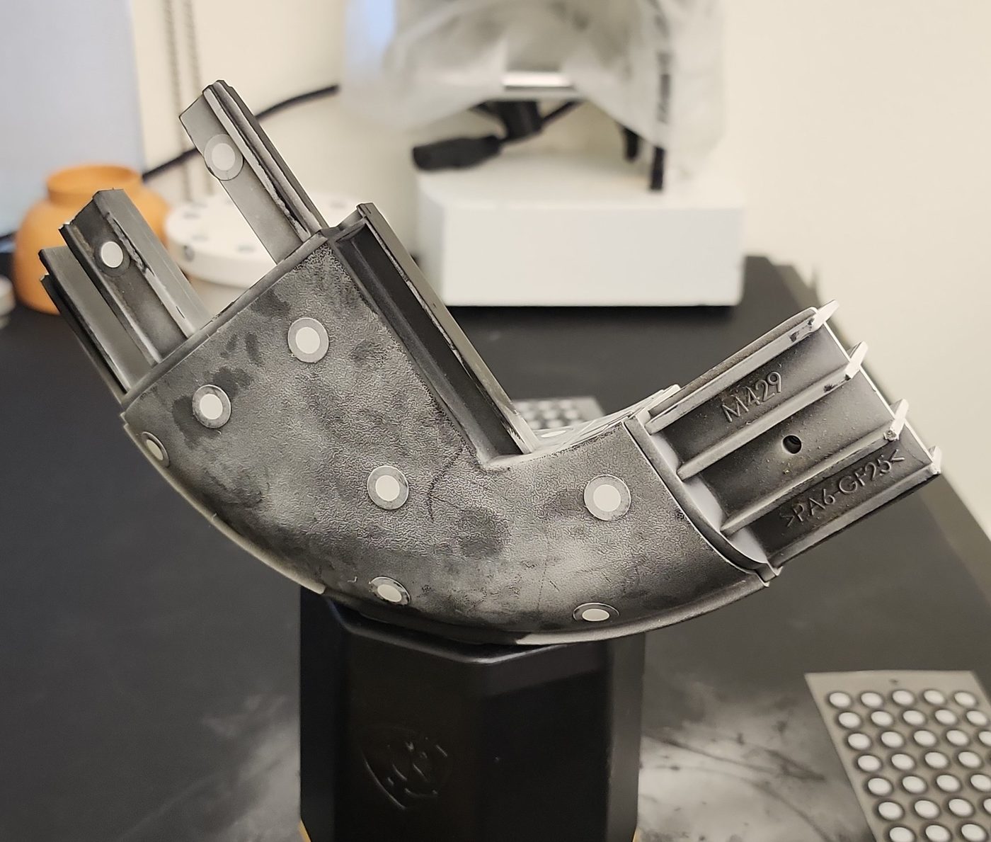 Truck component positioned on a precision three-dimensional scanner